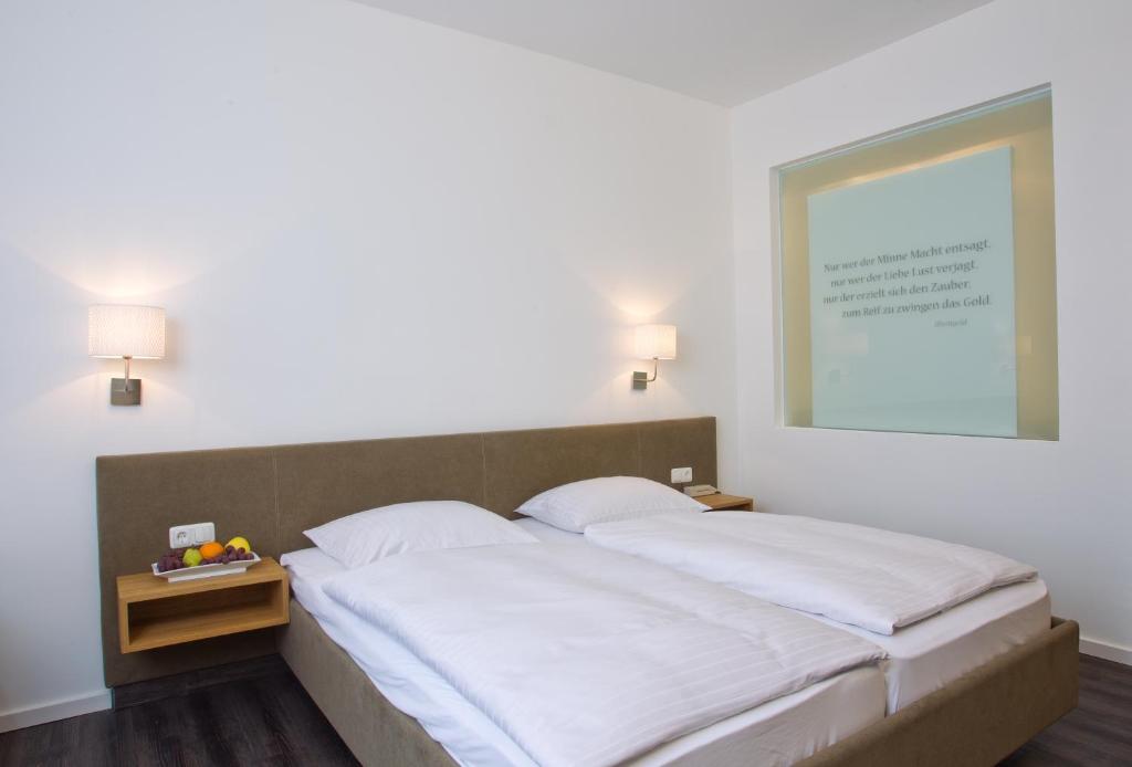Postel nebo postele na pokoji v ubytování Hotel Alexandersbad