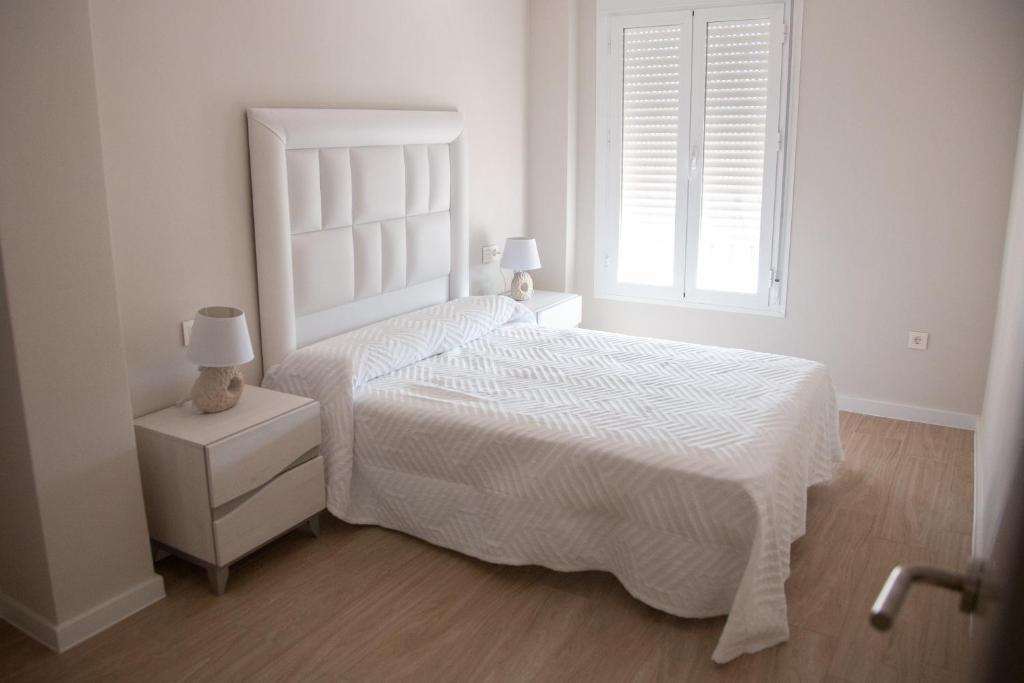 Posteľ alebo postele v izbe v ubytovaní Apartamento BellaVista