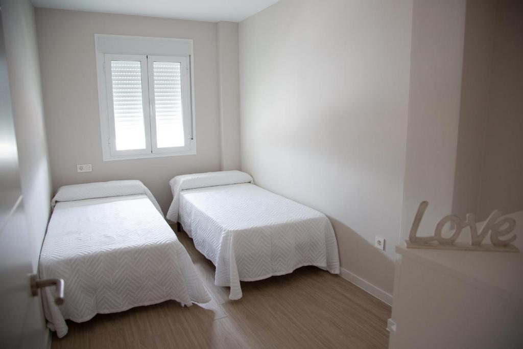 Posteľ alebo postele v izbe v ubytovaní Apartamento BellaVista
