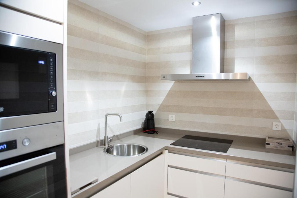 Kuchyňa alebo kuchynka v ubytovaní Apartamento BellaVista