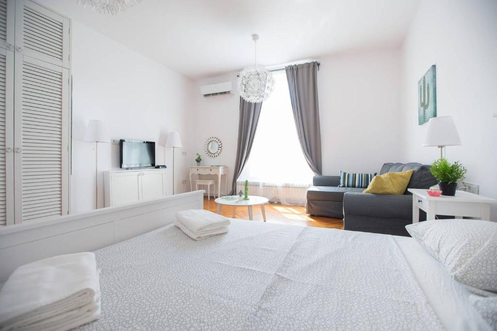 Oberiter Apartments - in the heart of Zagreb tesisinde bir odada yatak veya yataklar