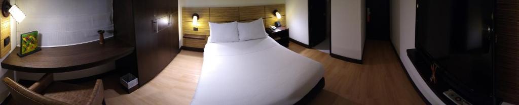 a white dress is on the floor of a room at Scala 68 in Bogotá