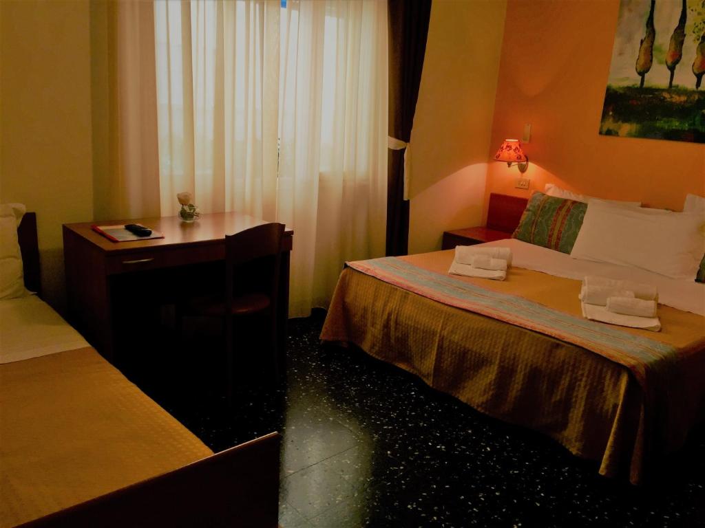 Postel nebo postele na pokoji v ubytování Hotel Scandinavia