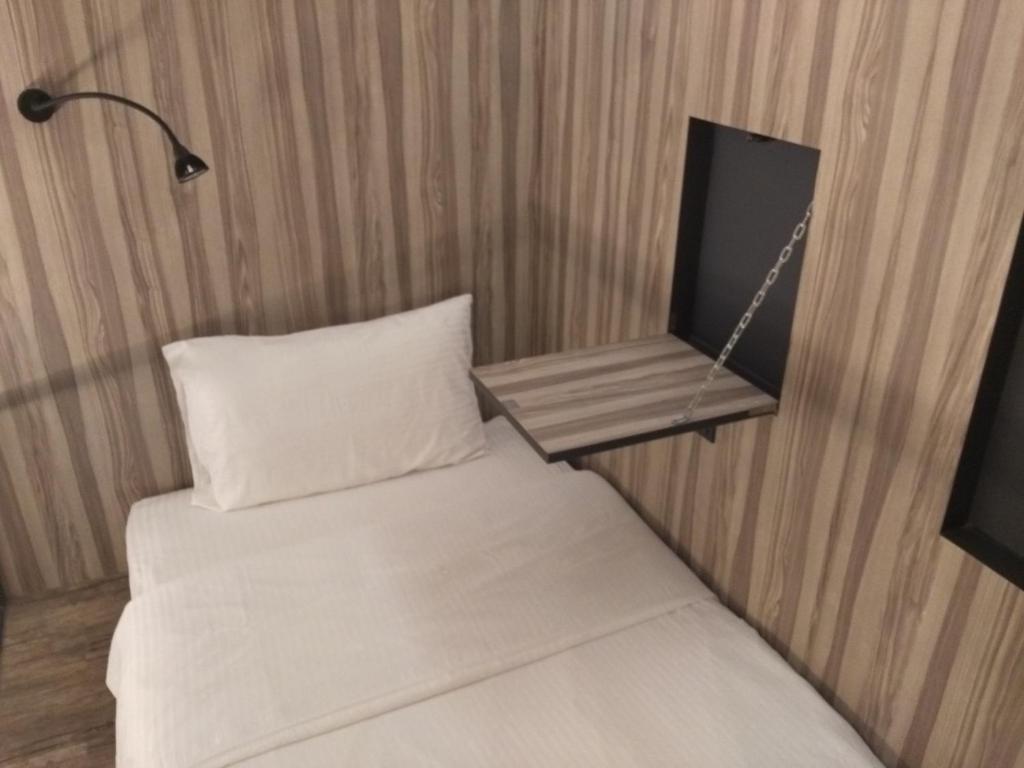 Postel nebo postele na pokoji v ubytování The Verve Hotel PJ Damansara