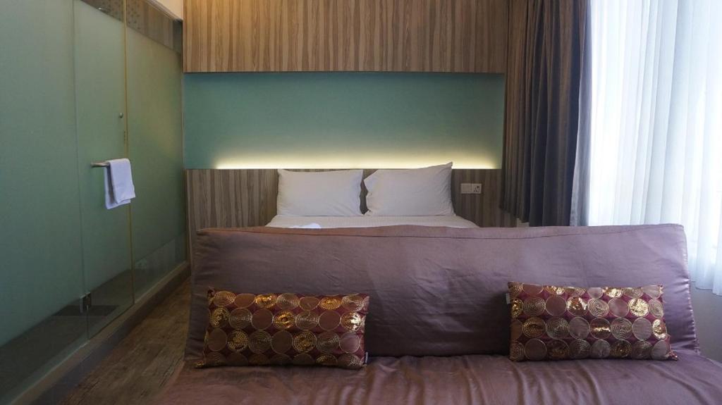 Postel nebo postele na pokoji v ubytování The Verve Hotel PJ Damansara