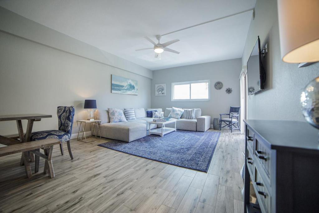 a living room with a couch and a table at Townhouse at San Remo in Clearwater Beach