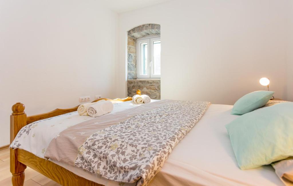 Postel nebo postele na pokoji v ubytování Apartmani Rebac