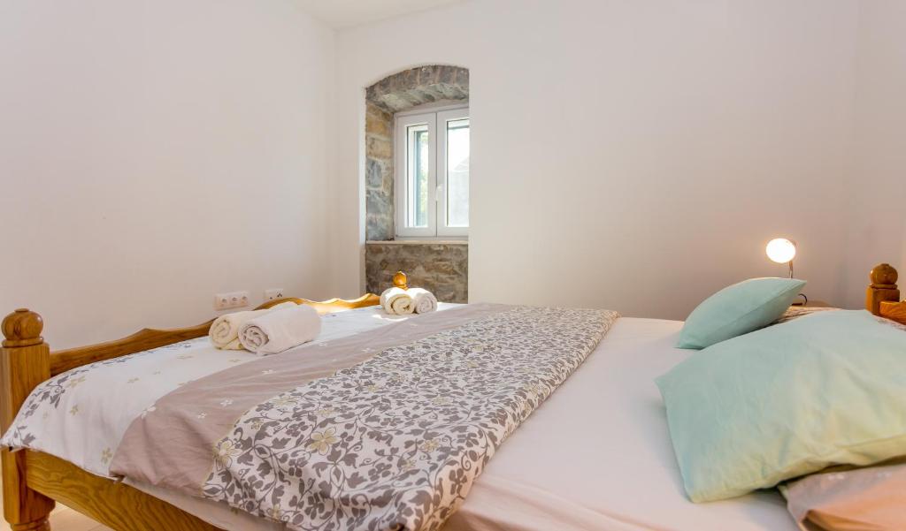 Postel nebo postele na pokoji v ubytování Apartmani Rebac