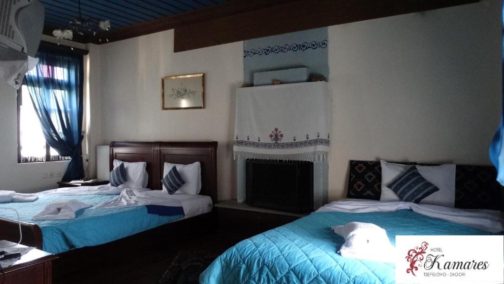 Tempat tidur dalam kamar di Hotel Kamares