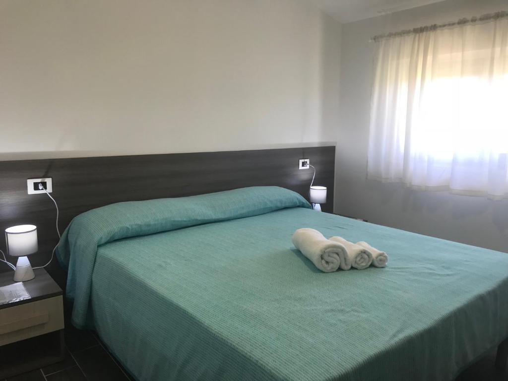 Postel nebo postele na pokoji v ubytování Villa Laregina