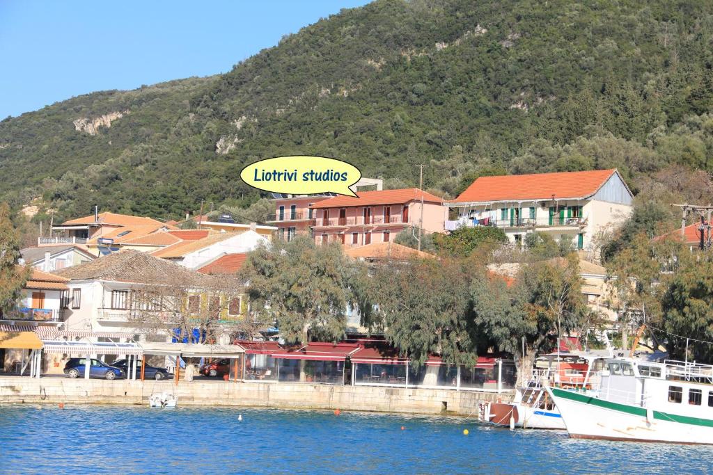 a town on the shore of a body of water at Liotrivi Studios in Vasiliki