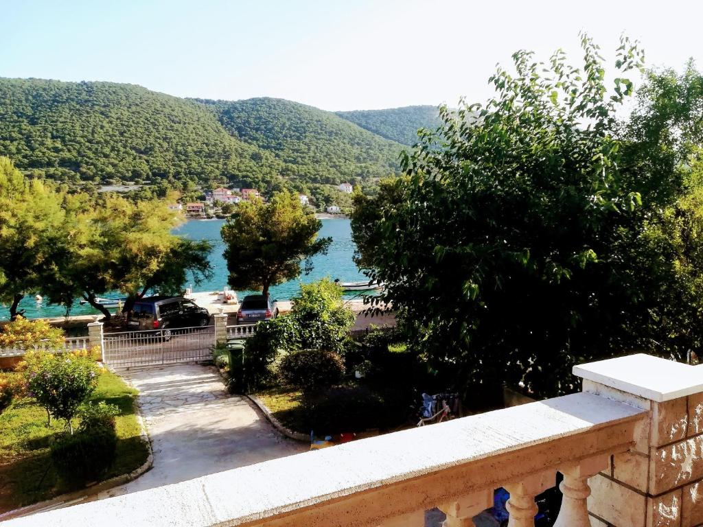 a view of a lake from a balcony at Open Sea Apartmani in Grebaštica