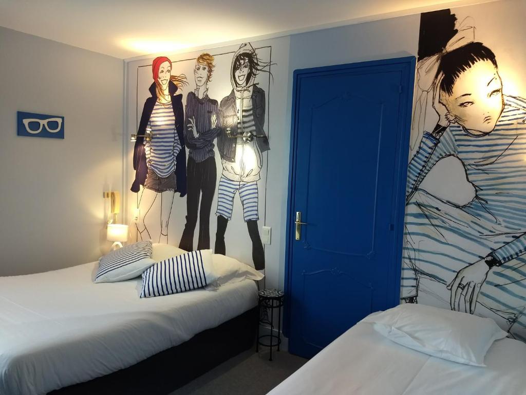 Postel nebo postele na pokoji v ubytování Hôtel Patton