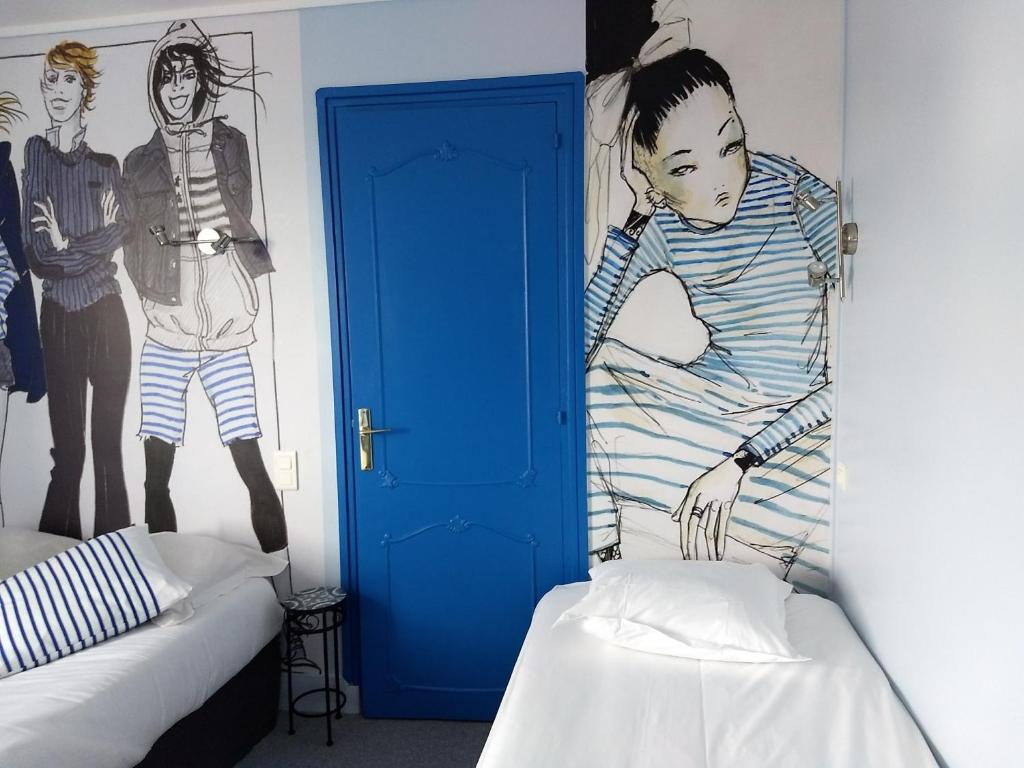 Postel nebo postele na pokoji v ubytování Hôtel Patton