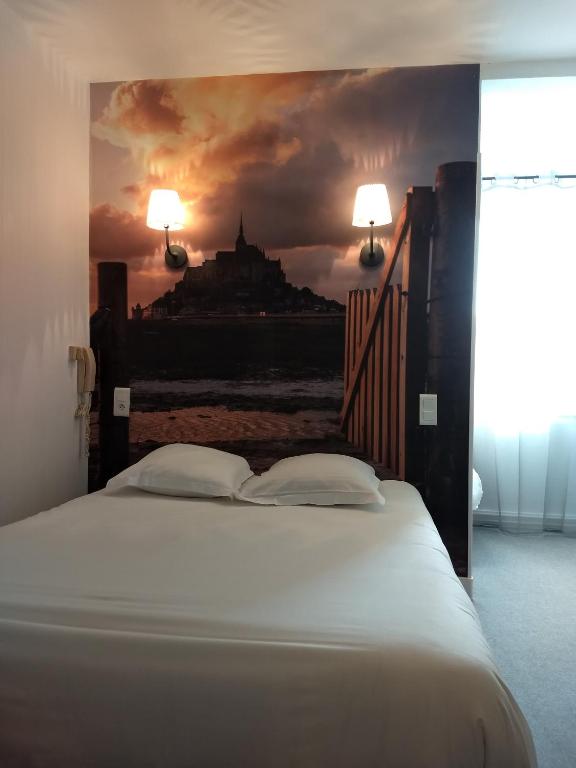 Postel nebo postele na pokoji v ubytování Hôtel Patton