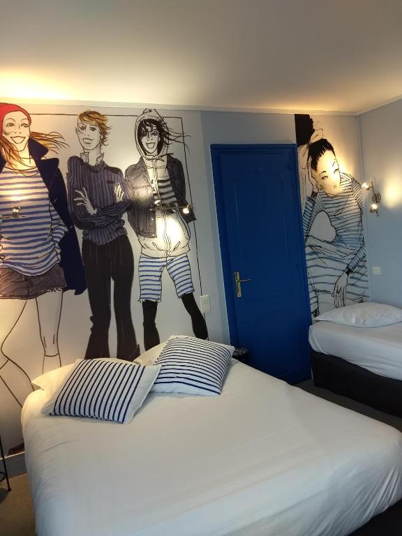 Postel nebo postele na pokoji v ubytování Hôtel Patton