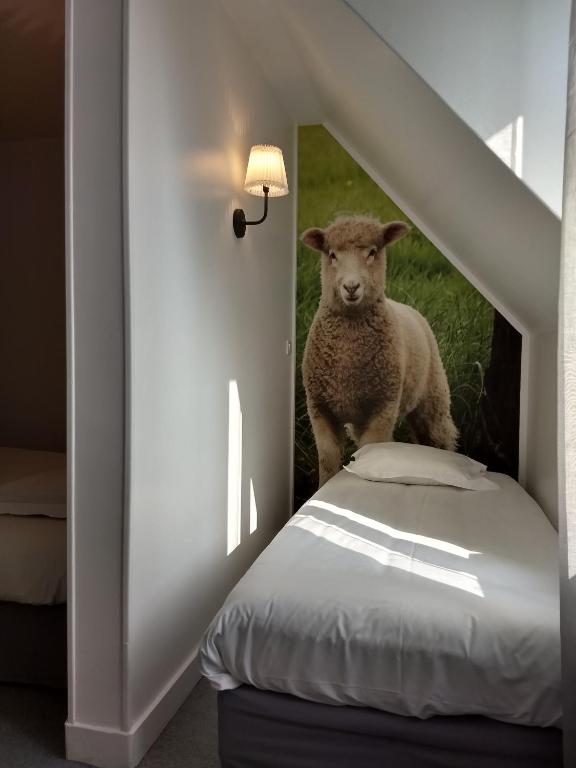 Postel nebo postele na pokoji v ubytování Hôtel Patton