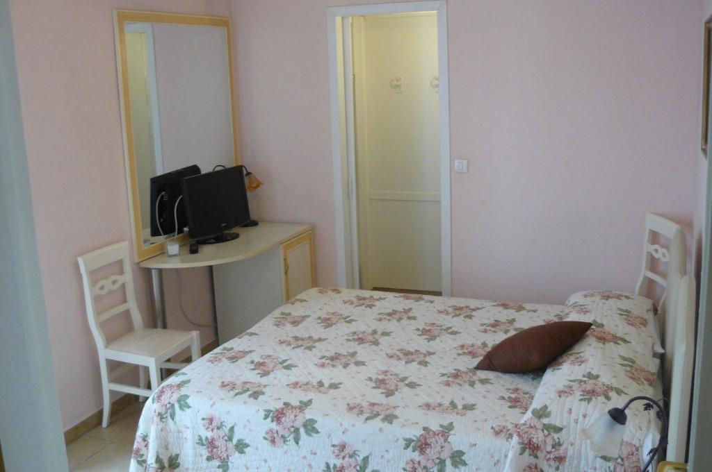 Postel nebo postele na pokoji v ubytování Hotel Vittoriano