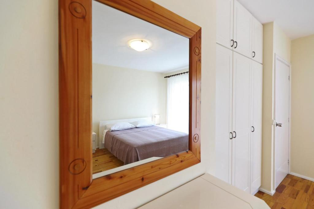 Posteľ alebo postele v izbe v ubytovaní Girica Apartments