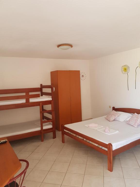 Postel nebo postele na pokoji v ubytování Apartments Denis
