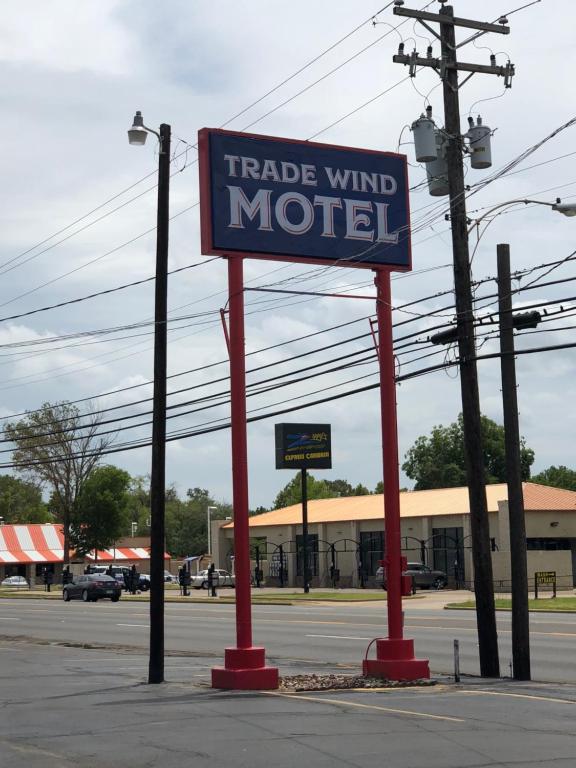 a market wind motel sign on the side of a street at Trade Wind Motel in Jacksonville