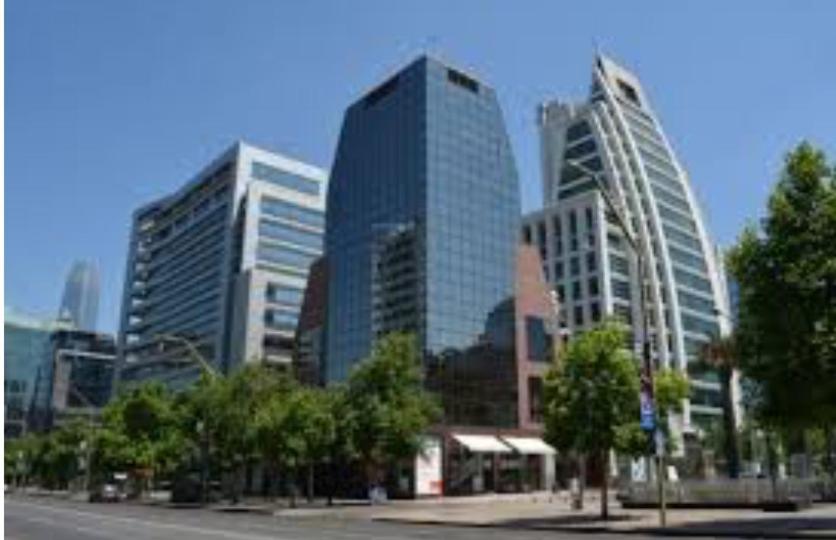 a group of tall buildings in a city at Departamento en el Golf in Santiago