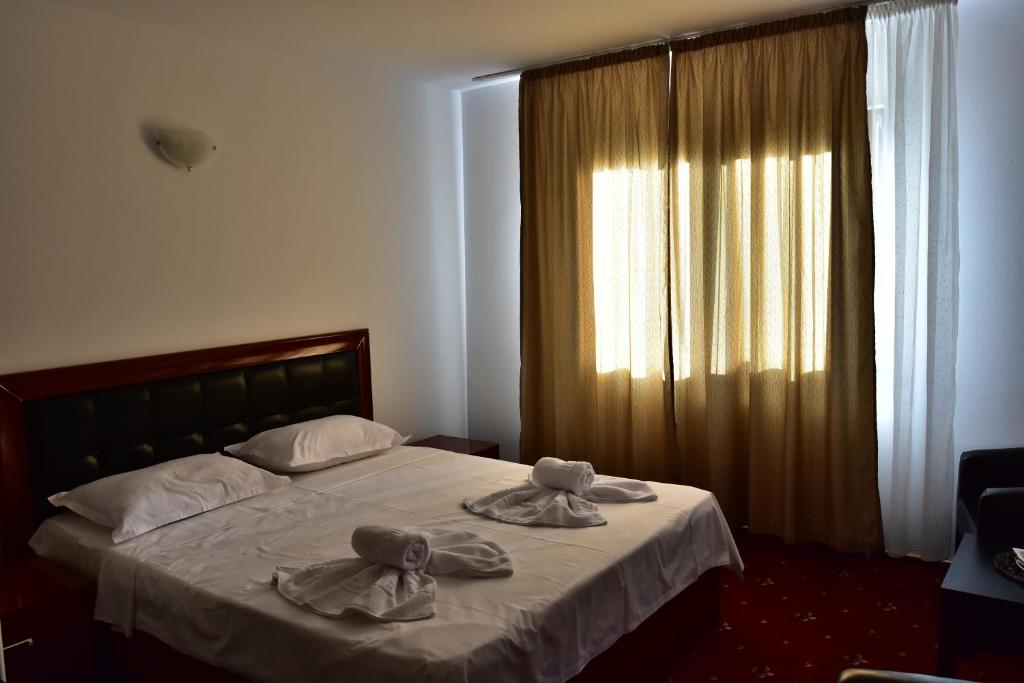 Postel nebo postele na pokoji v ubytování Hotel Ostrov