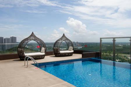 a swimming pool on the roof of a building at Afiniti Residences in Johor Bahru