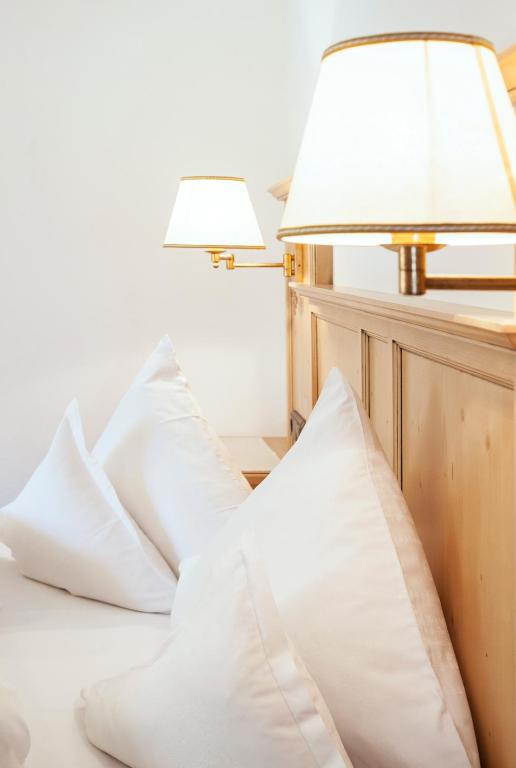 Postel nebo postele na pokoji v ubytování Hotel Garni Glockenstuhl