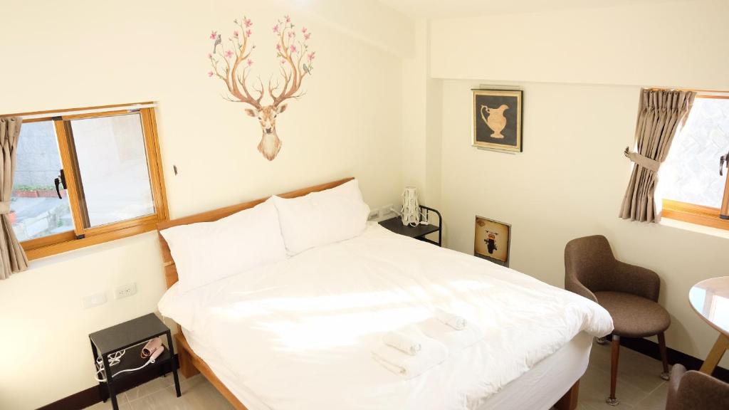 Postel nebo postele na pokoji v ubytování Yo Ho 23 Homestay