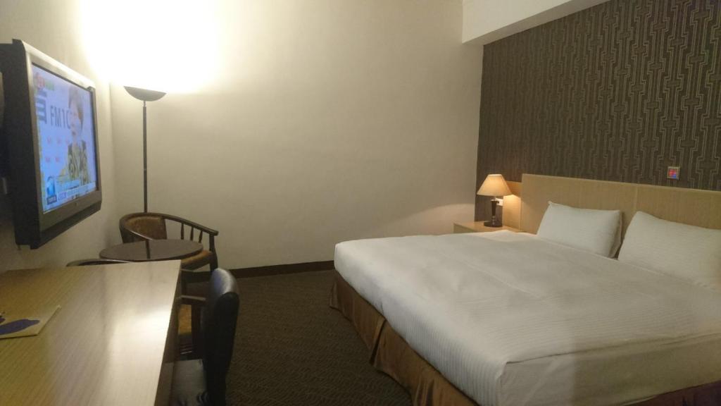 Postel nebo postele na pokoji v ubytování Dreamer Hotel