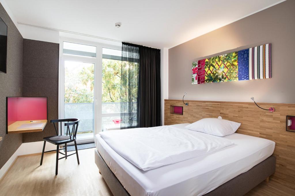 Postel nebo postele na pokoji v ubytování fab Hotel