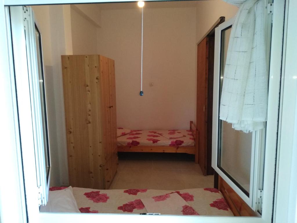 Postel nebo postele na pokoji v ubytování Velikis Apartments