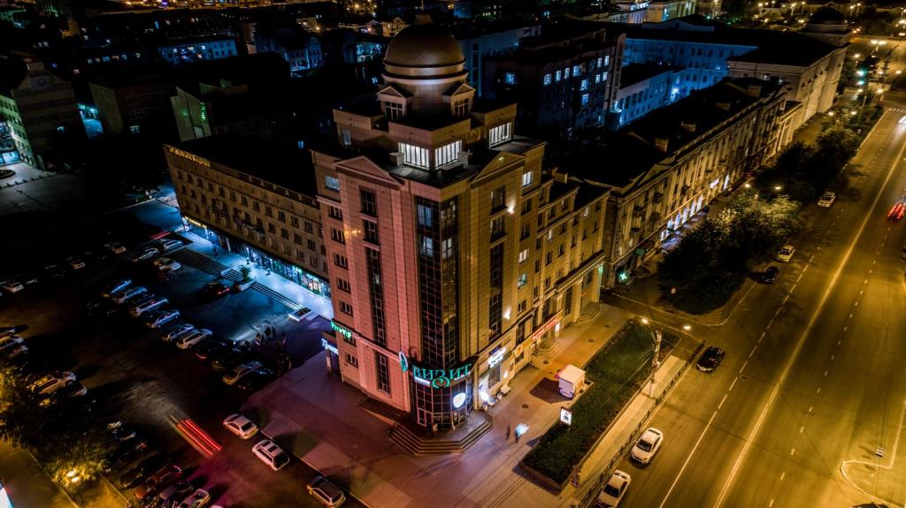 an aerial view of a building in a city at night at Hotel Visit in Chita
