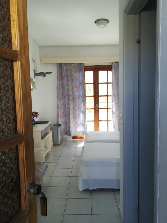 Postel nebo postele na pokoji v ubytování Amaliahotel
