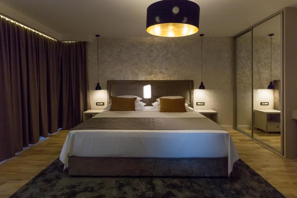 Posteľ alebo postele v izbe v ubytovaní Mirabilis Residence