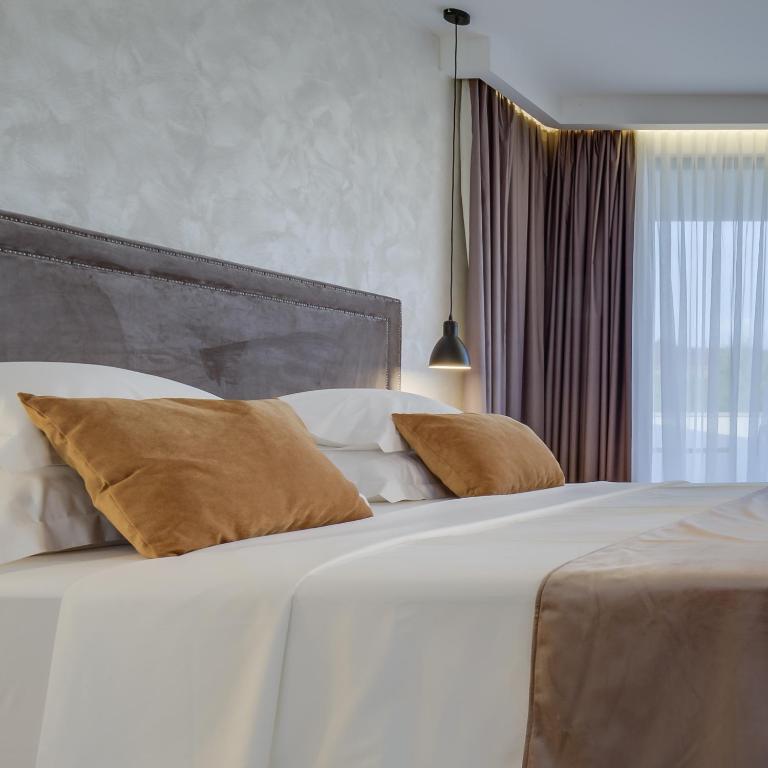 Posteľ alebo postele v izbe v ubytovaní Mirabilis Residence