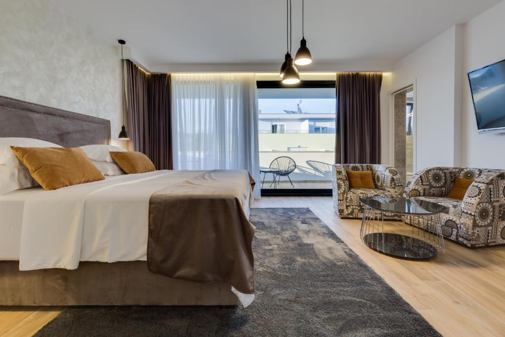 Posteľ alebo postele v izbe v ubytovaní Mirabilis Residence