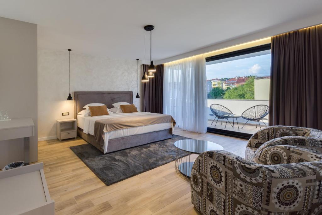Posteľ alebo postele v izbe v ubytovaní Mirabilis Residence
