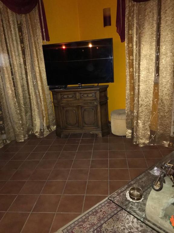 TV a/nebo společenská místnost v ubytování Mirella's House ViaVerona