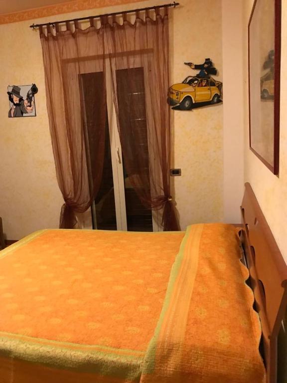 Postel nebo postele na pokoji v ubytování Mirella's House ViaVerona