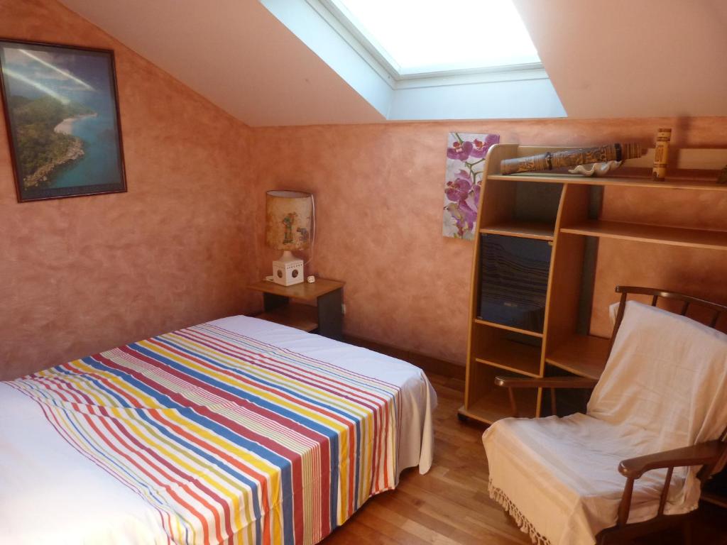 Ein Bett oder Betten in einem Zimmer der Unterkunft Villa Flamboyant