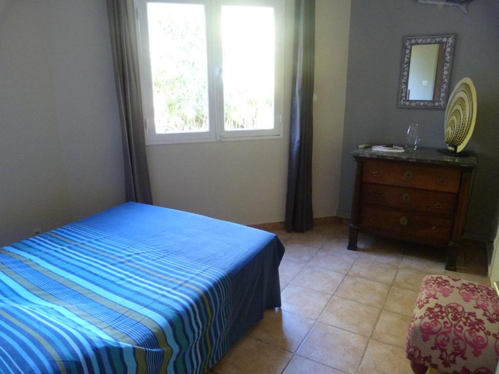 Ein Bett oder Betten in einem Zimmer der Unterkunft Villa Flamboyant