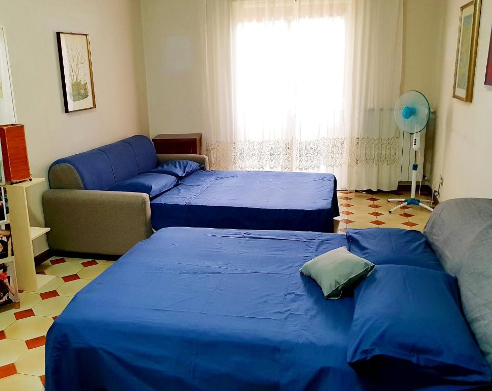 Postel nebo postele na pokoji v ubytování Catania house Apartment