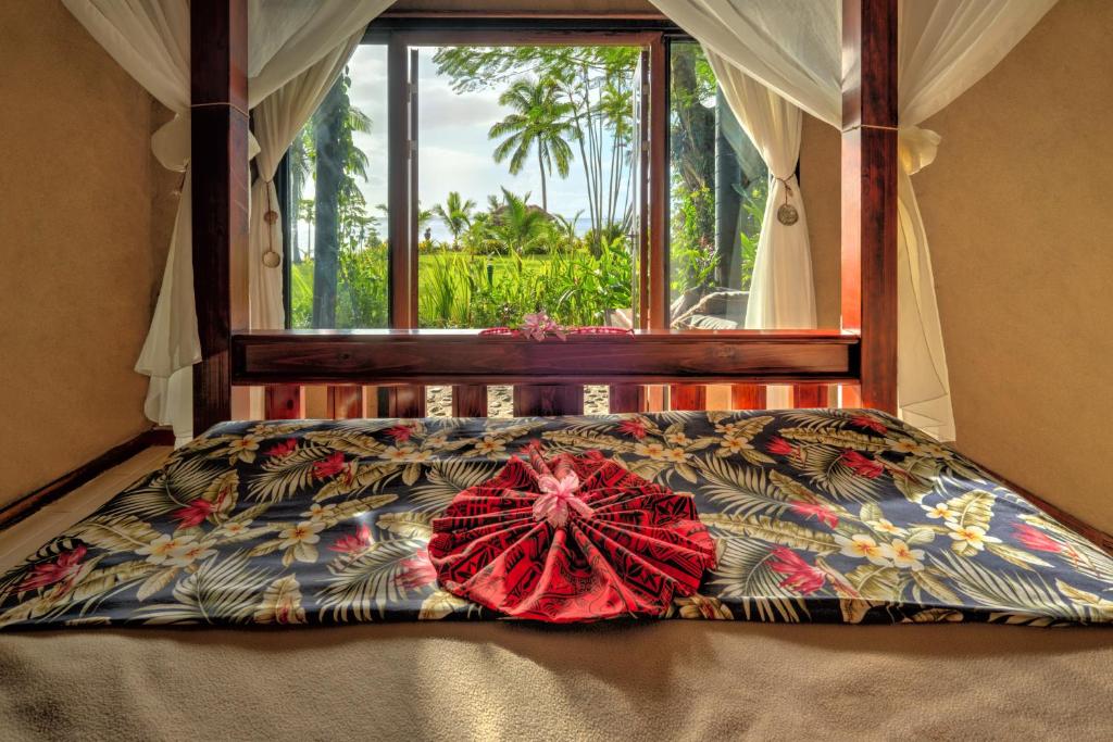 Postel nebo postele na pokoji v ubytování Paradise Taveuni