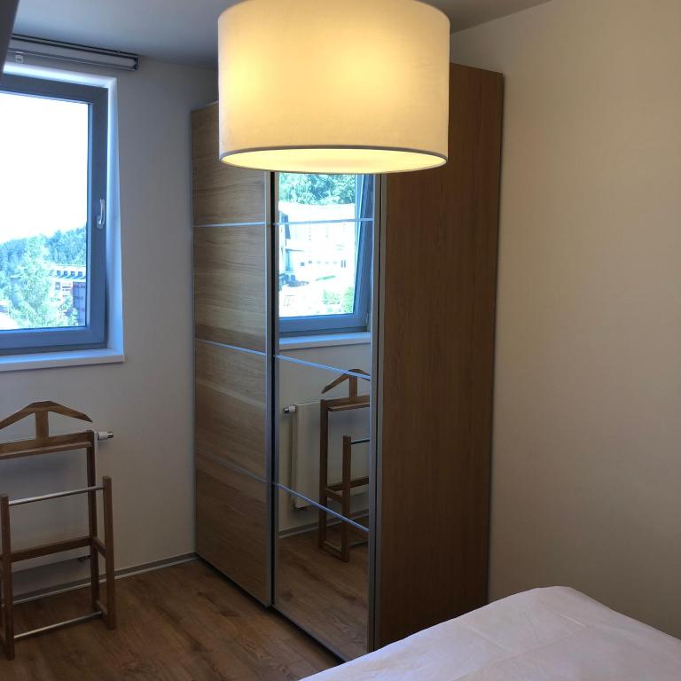 Postel nebo postele na pokoji v ubytování Apartmán Jestřáb