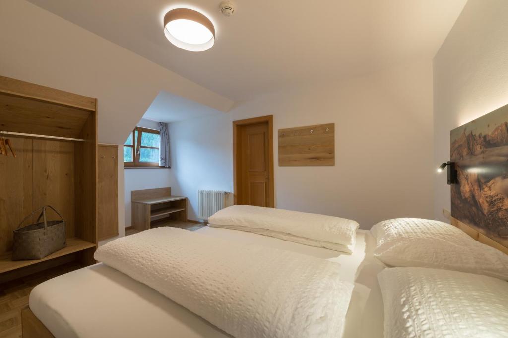 Postel nebo postele na pokoji v ubytování Residence Edelweiss