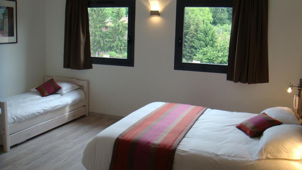 Postel nebo postele na pokoji v ubytování Côté Hôtel