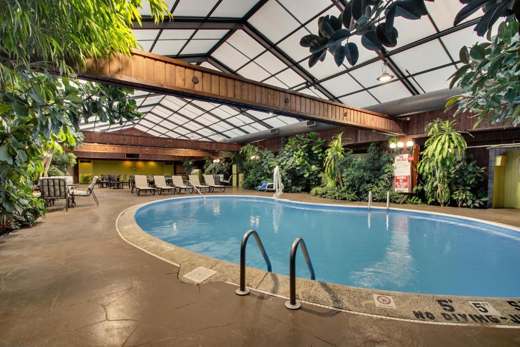 a large swimming pool in a building with at Wingfield Inn & Suites in Elizabethtown