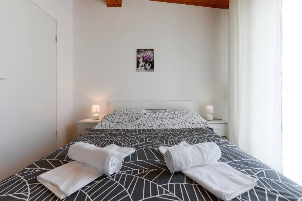 Łóżko lub łóżka w pokoju w obiekcie Diva Apartment